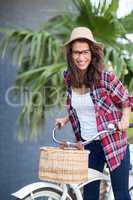 Portrait of young woman riding a bicycle