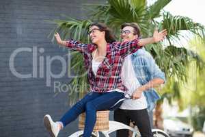 Young couple riding on a bicycle