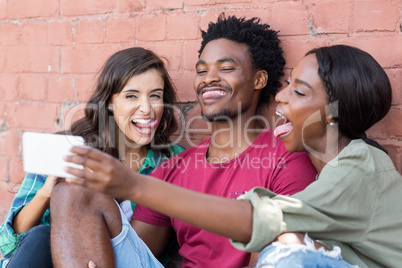 Friends taking selfie on a mobile phone