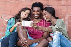 Friends taking selfie on a mobile phone