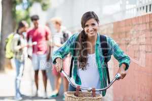 Portrait of young woman riding a bicycle
