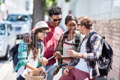 Man showing mobile phone to his friends