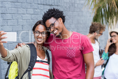 Couple taking selfie on a mobile phone