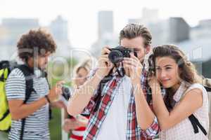 Young couple taking photo