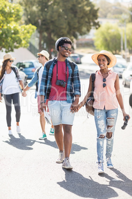 Young couple walking on road