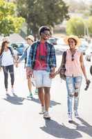 Young couple walking on road