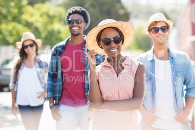 Friends in smiling at camera