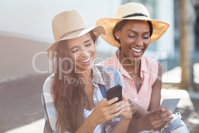 Young women using mobile phone Young women using mobile phone