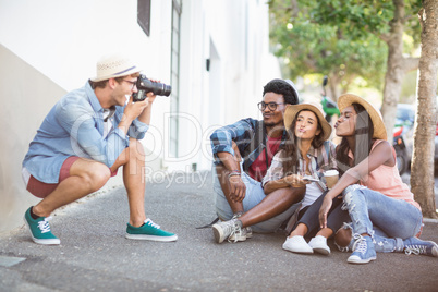 Man taking photo of his friends