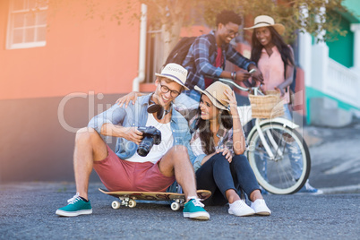 Couple sitting on road interacting with each other