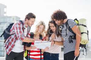 Friends looking at map