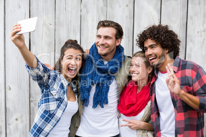 Friends taking selfie on a mobile phone