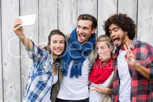 Friends taking selfie on a mobile phone