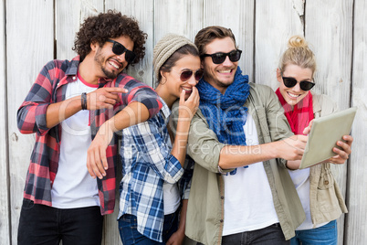 Friends taking selfie on digital tablet