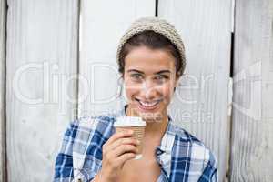 Woman holding disposable cup
