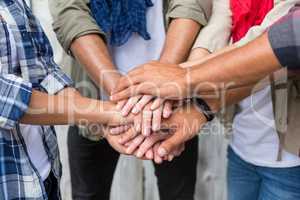 Friends putting their hands together