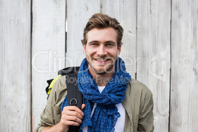 Young man carrying backpack