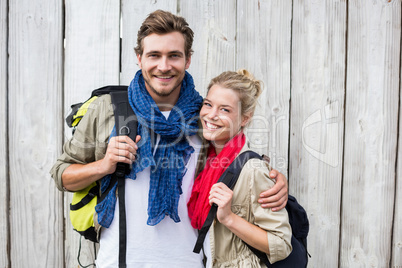 Young couple carrying rucksack