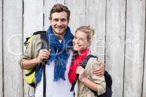 Young couple carrying rucksack