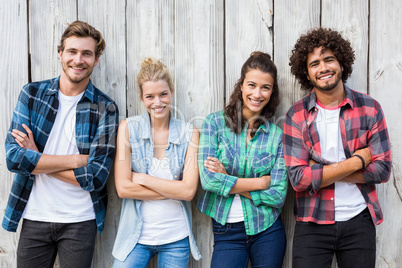 Friends leaning with arms crossed