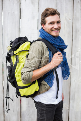 Young man carrying backpack