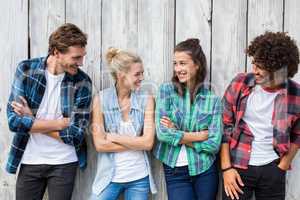 Friends leaning with arms crossed