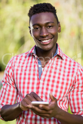 Happy man using his smartphone