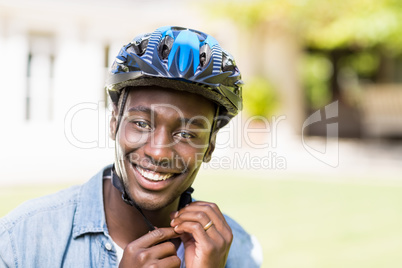 Happy man wearing his helmet