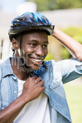 Happy man wearing his helmet