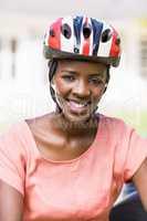 Happy woman wearing her helmet