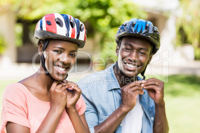 Happy couple wearing their helmet