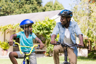 Happy family doing bicycle