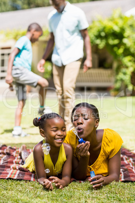 Happy family doing bubbles