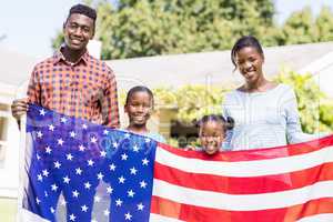 Happy family showing usa flag