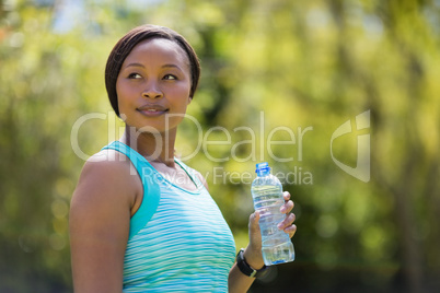 Woman holding water bottle