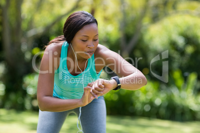 Woman looking her watch