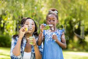 Happy family doing bubbles