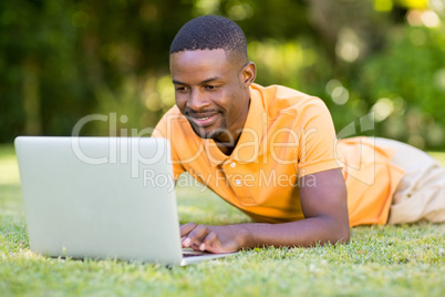 Happy man using his laptop