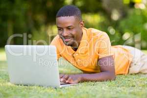 Happy man using his laptop