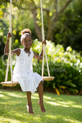 Young girl doing swing