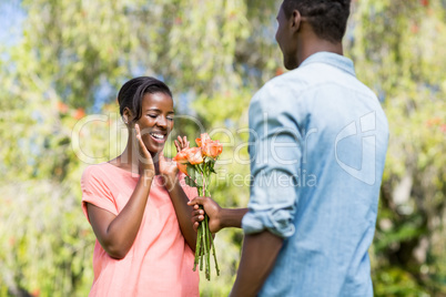 Happy woman having flowers