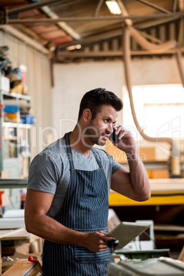 Carpenter on the phone