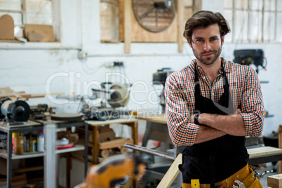 Carpenter is posing with his craft