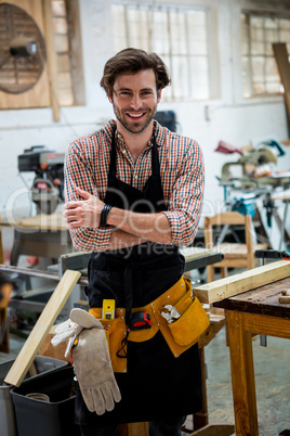 Carpenter is posing with his craft