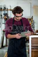 carpenter using his tablet