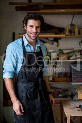 Carpenter is posing and smiling