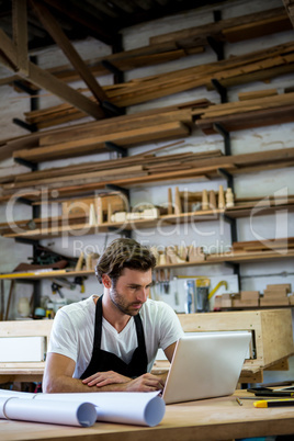 Carpenter is using his tablet