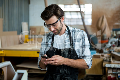 Carpenter texting someone