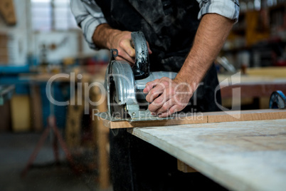 Carpenter working on his craft Carpenter working on his craft
