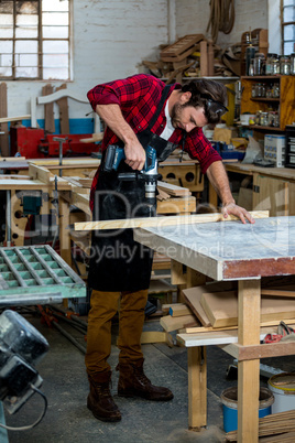 Carpenter working on his craft